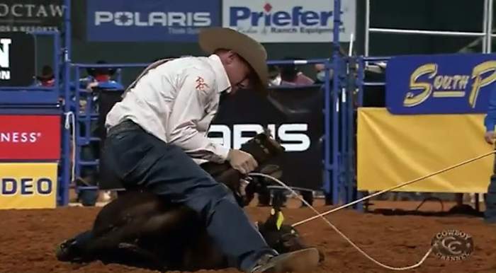 Hunter Herrin ropes a calf.